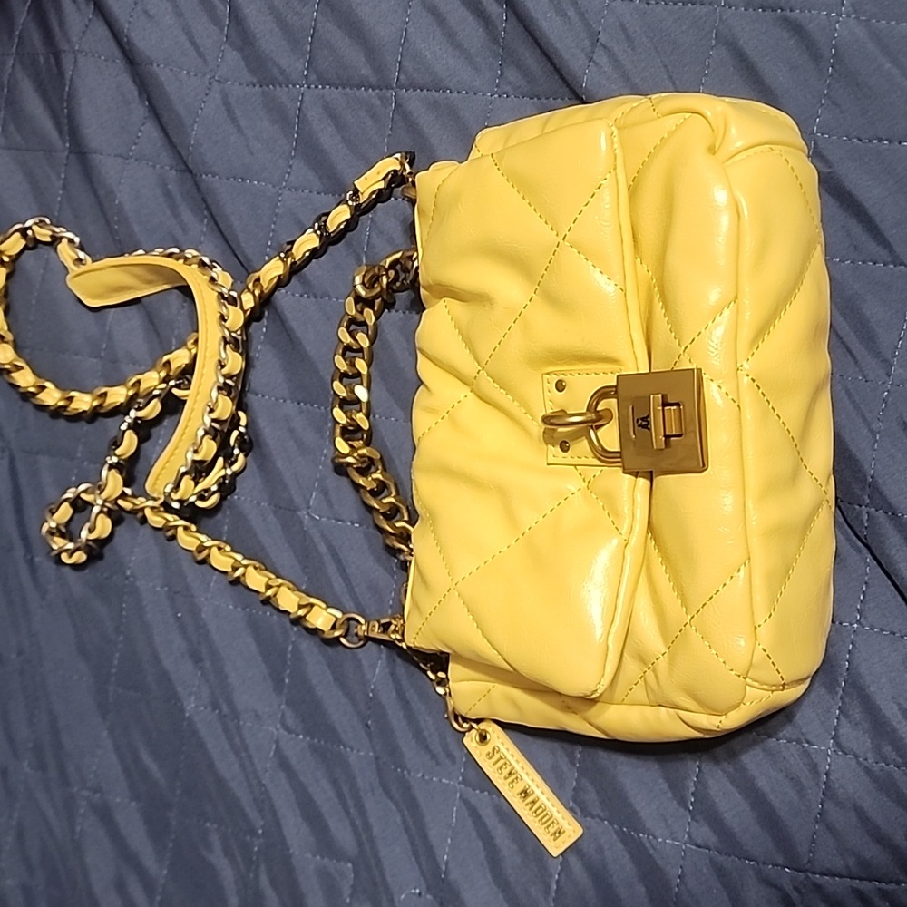 Purse from Steve Madden lock button and over the shoulder chain used once